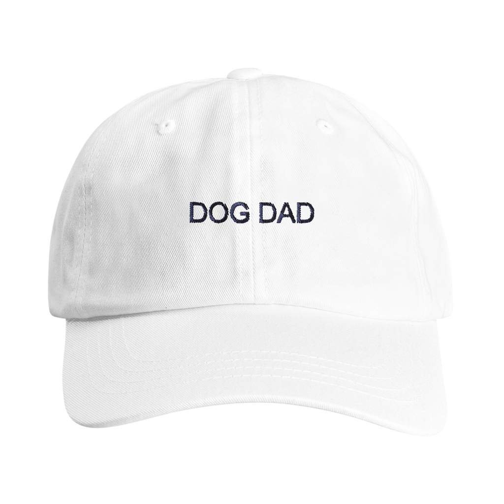 


A white cotton baseball cap with 'DOG DAD' embroidered in navy blue block letters on the front, shown against a plain white background.